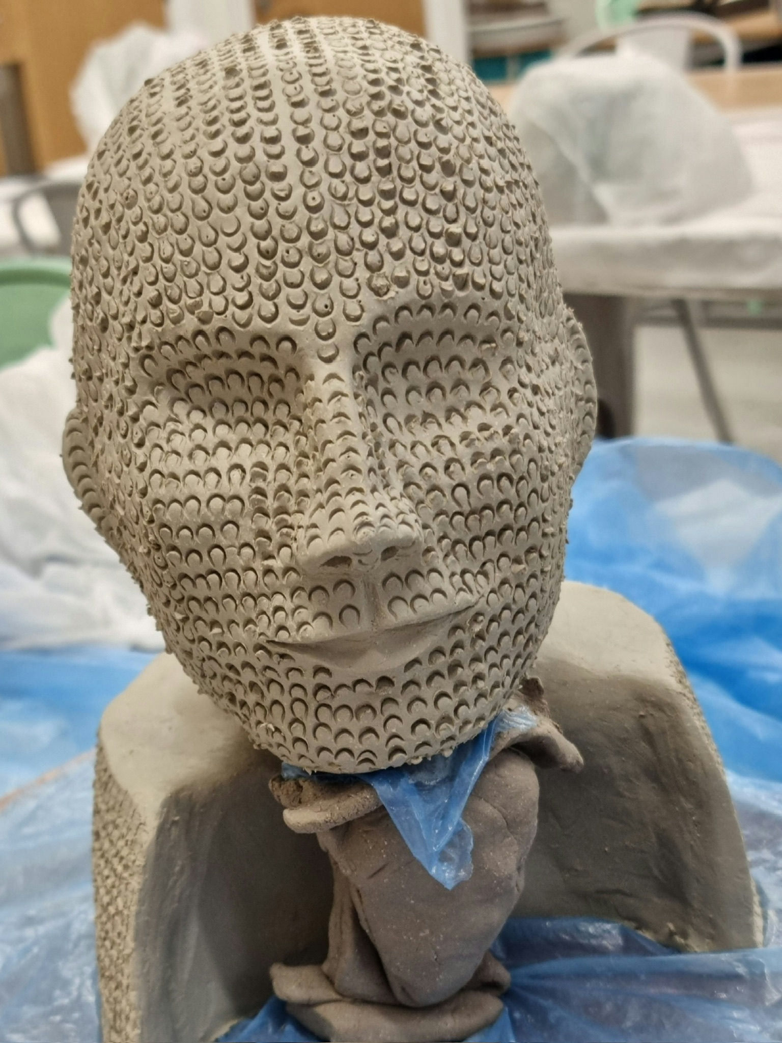 Textured portrait head sculpture