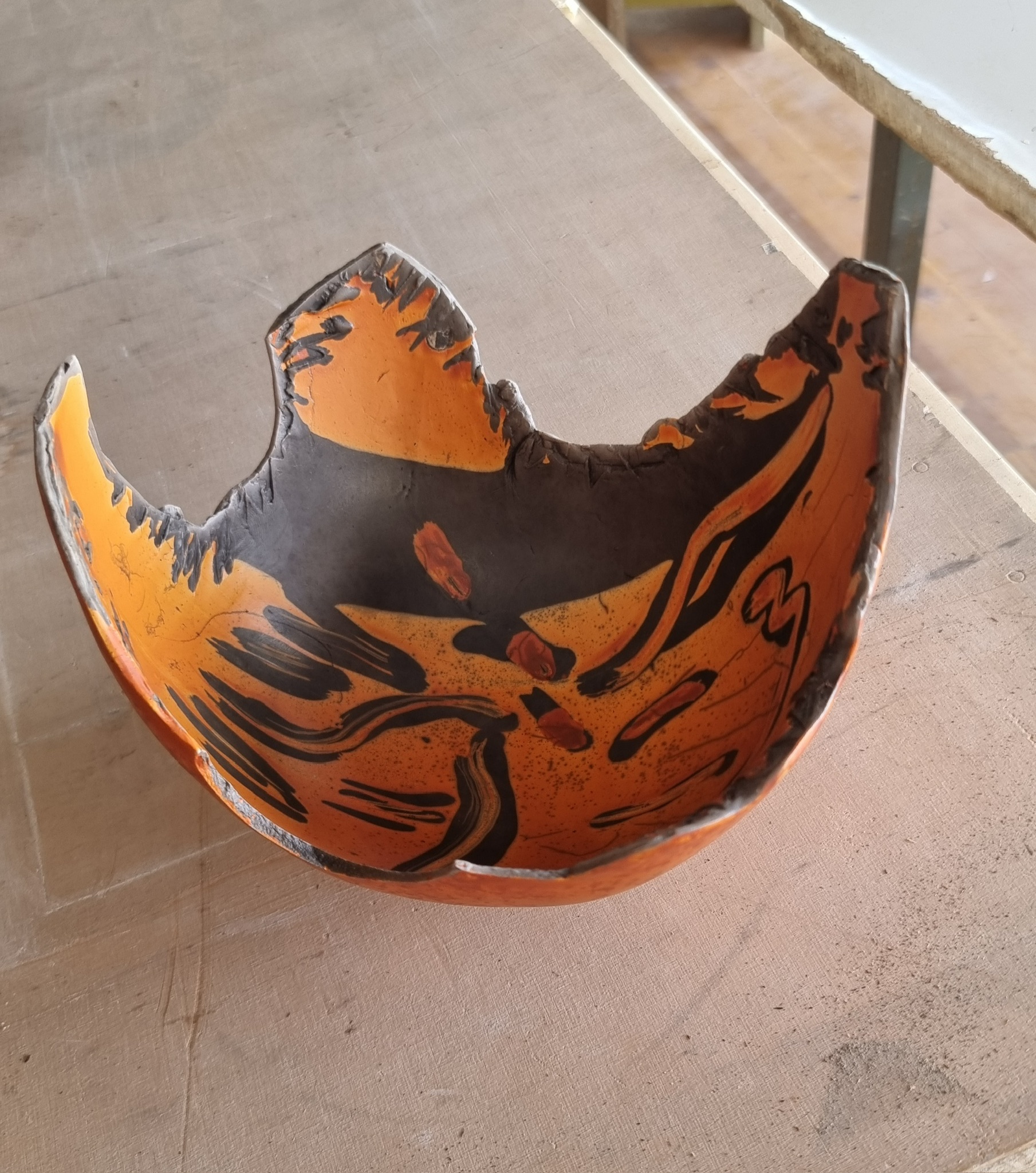 Raku bowl with amber and black glaze