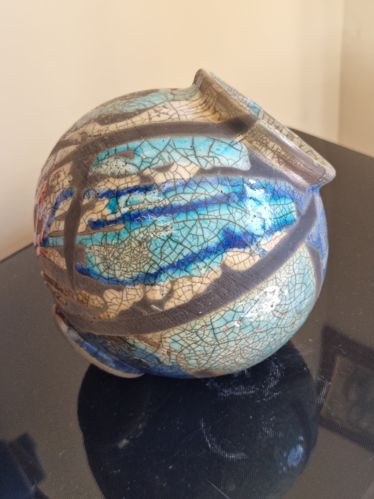 Raku-fired blue crackle globe vessel