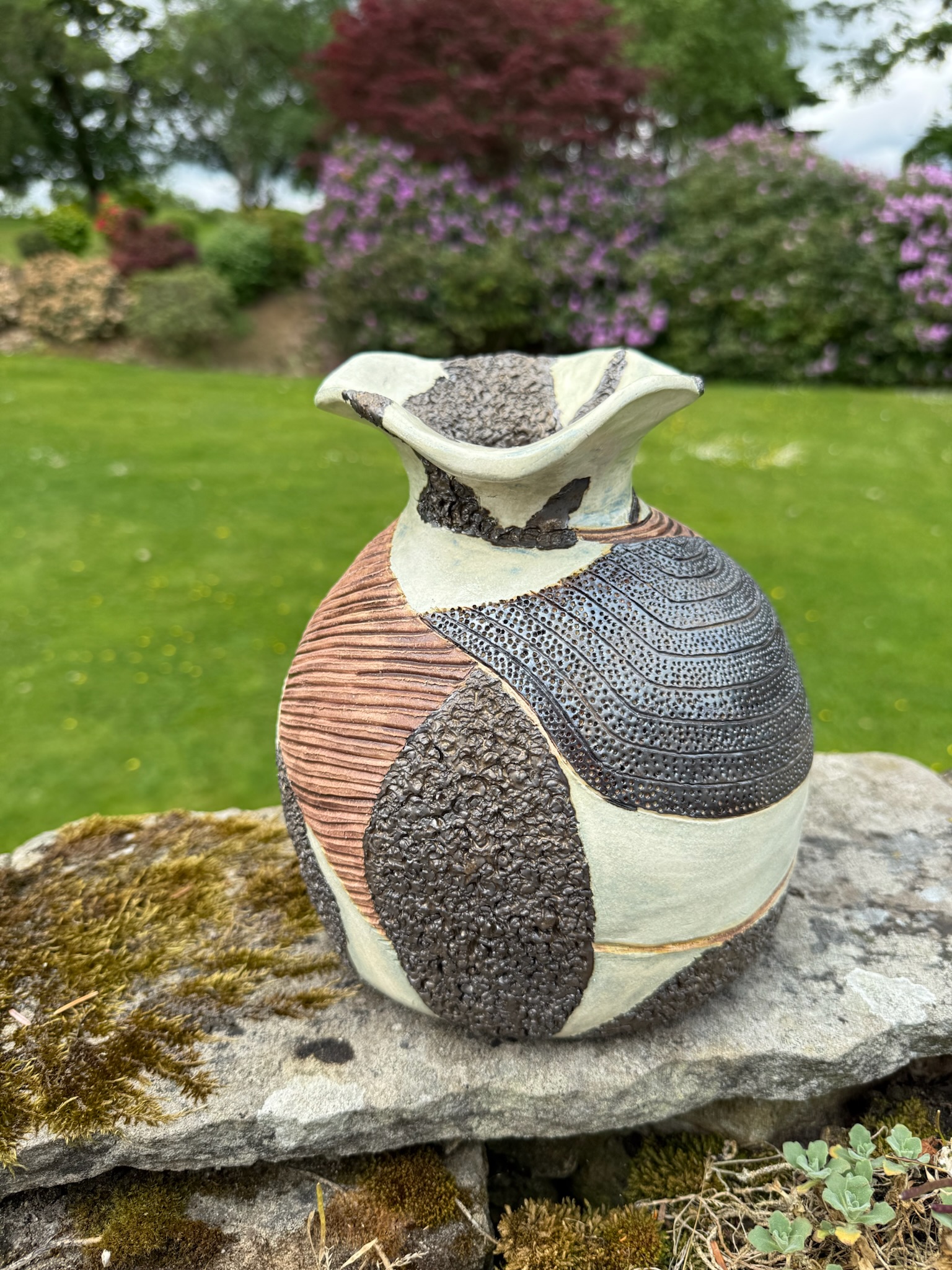 Wheel-thrown vessel — garden setting