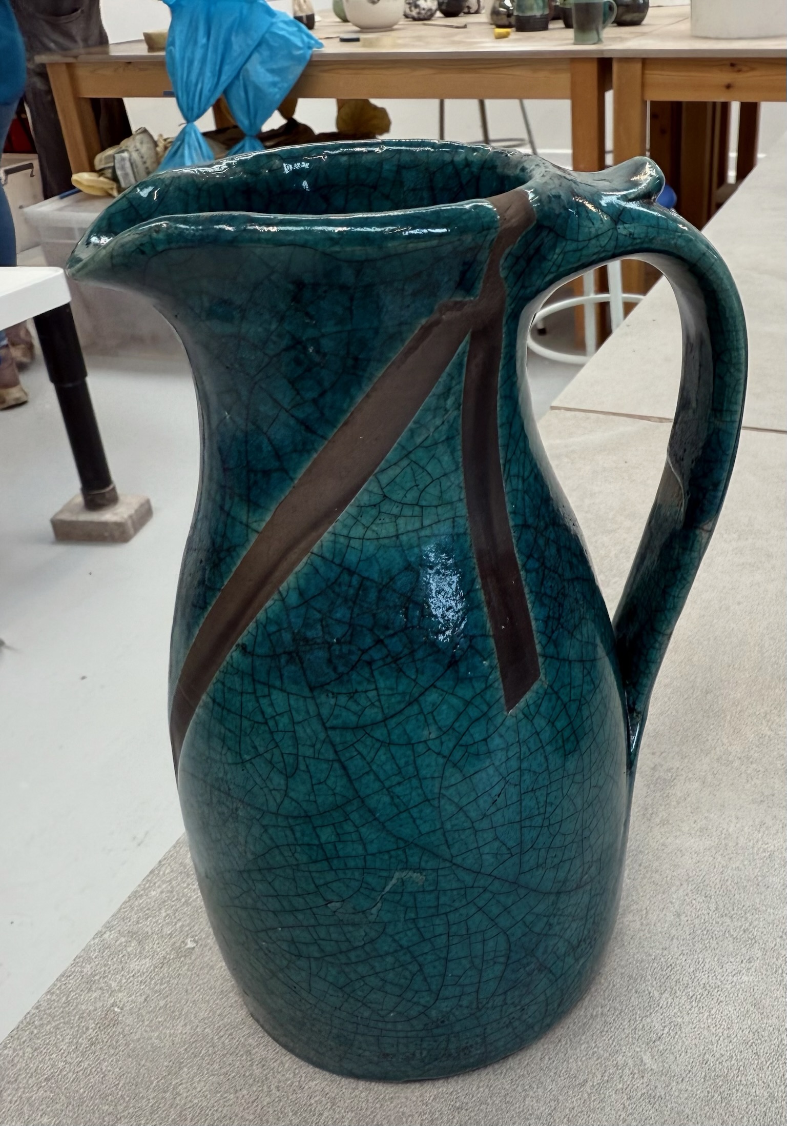 Raku-fired teal crackle pitcher