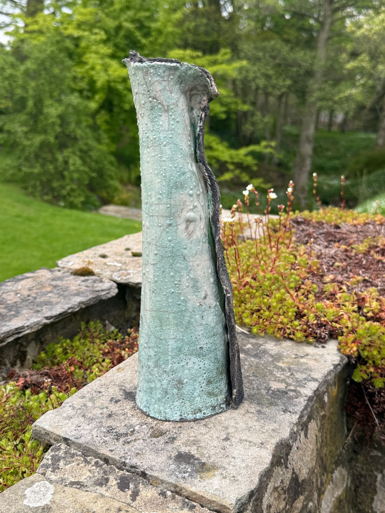 Two-tone hooded vessel, celadon face with charcoal seam