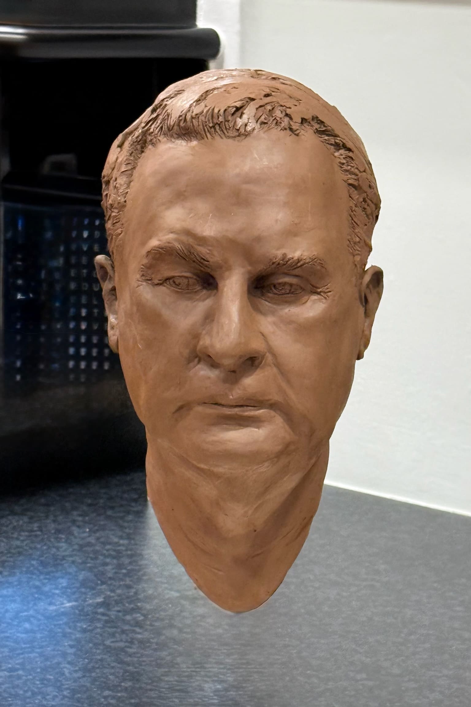 Terracotta portrait head sculpture — male, frontal view